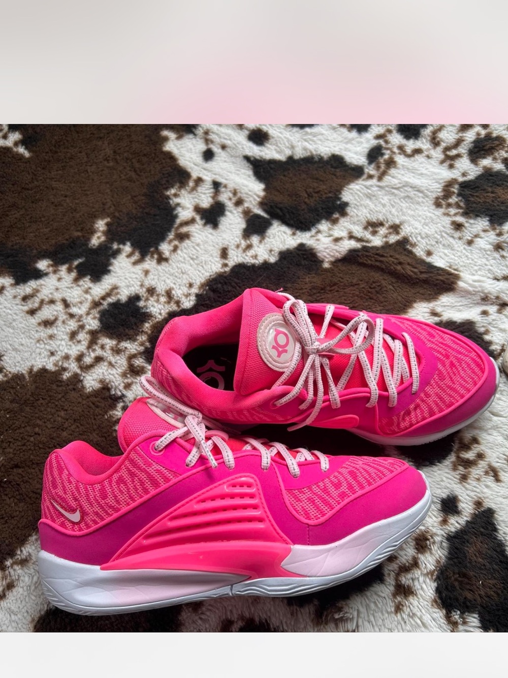 Custom Kd pink basketball shoes.